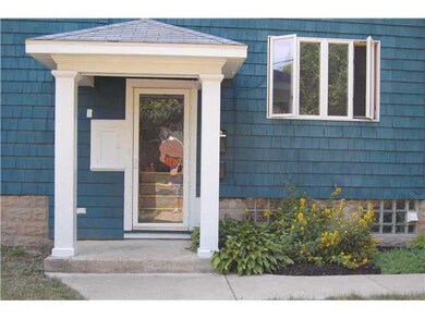 Exterior Front. Grand side entrance. Glass block i