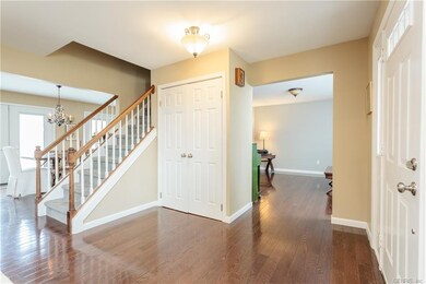 Foyer is conveniently centralized in the home. Han