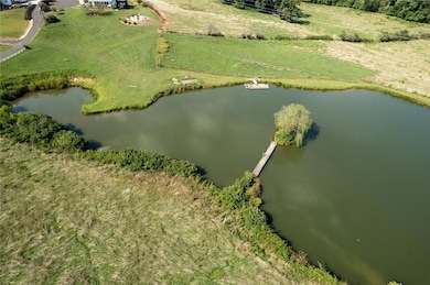 Nature enthusiasts will appreciate the serene pond, perfect for canoeing or kayaking.
