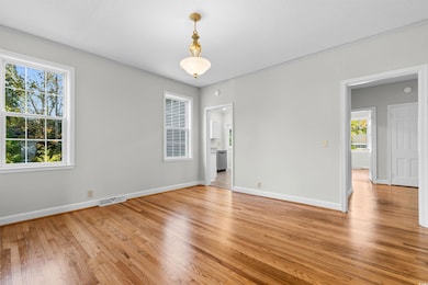 Unfurnished room with light wood-type flooring
