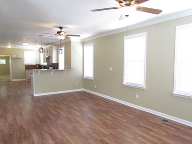 The dining space leads into the new gourmet kitche