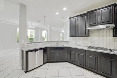 Kitchen with a sink, crown molding, under cabinet