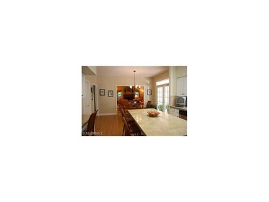 Roomy eat-in kitchen with marble countertops, hard