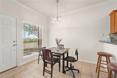 Dining space featuring an inviting chandelier, lig