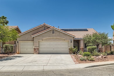 View of front of property featuring a tiled roof,