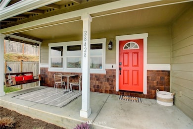 The covered porch on the north side of the home offers great views of the mountains.