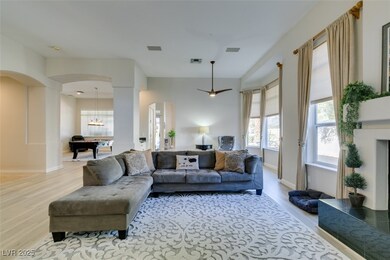 Living area with light wood-style floors, visible