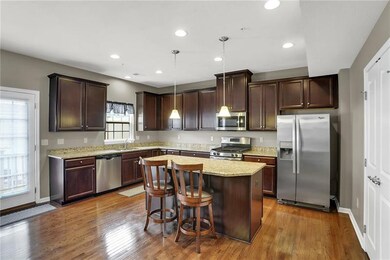 Large open kitchen, well lit from sliding glass do