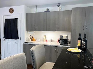 Kitchen with light stone countertops