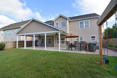 Built in swing set with outdoor grill area/island