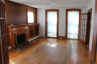 Living room with wood floors, fireplace and floor 