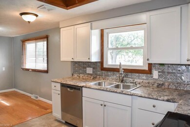 Completely new kitchen with tin backsplash.