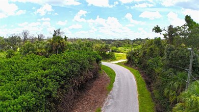 Street view to the east.  Lot is on the left.
