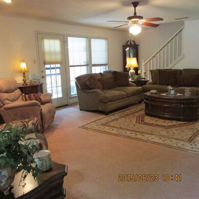 Large den for the family. Nice fireplace for those
