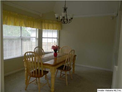 Sunny Dining Room Showing off a Bay Window at the 