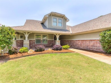 View of front facade featuring a porch and a front lawn