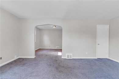 Empty room featuring carpet flooring