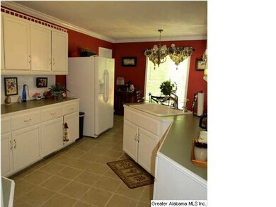 Spacious kitchen with tile flooring, breakfast are