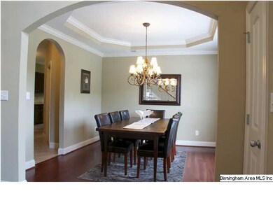 DINING ROOM WITH TREY CEILINGS AND ARCHWAYS