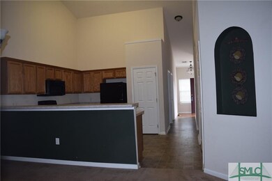 View of kitchen and hall from the dining room