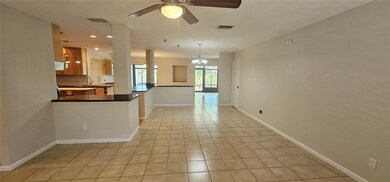 Welcoming living room leads to dining, kitchen and Florida Room