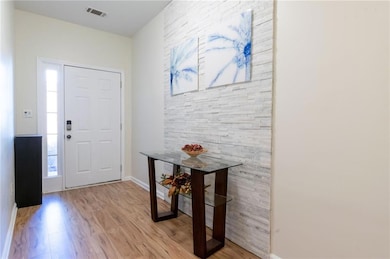 Entrance foyer featuring light hardwood / wood-sty
