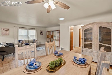 Dining area with ceiling fan