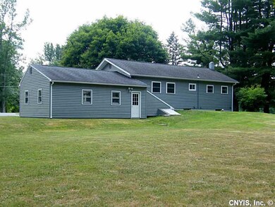 Exterior Back. Newer Vinyl Siding, Windows, Doors.