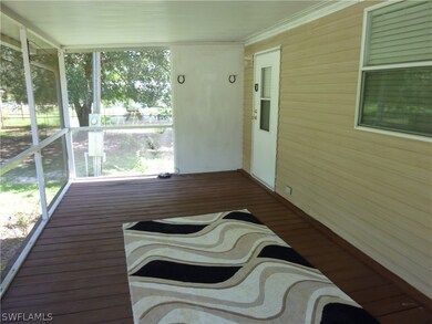 Large Screened in cool and shady Porch to Home Entry