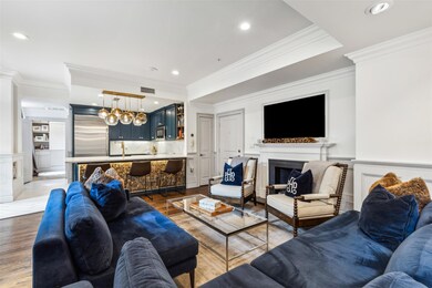 Living room featuring crown molding and wood-type 