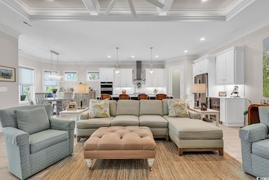 Living area with recessed lighting, beamed ceiling