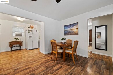 Dining room with a ceiling fan and wood finished floors