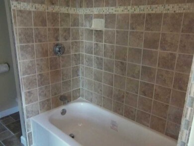 Exterior Front. Tiled bath.