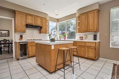 Large center island with breakfast counter/bar giv