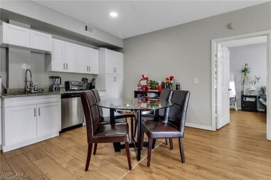 Dining area featuring light wood-style flooring, b