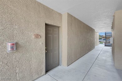 Property entrance with stucco siding