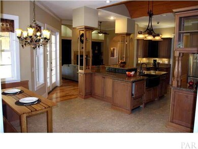 View from family room. Breakfast area with built-in bench seating to your left. Notice the 2 drawer dishwasher to the left of the hammered copper sink!