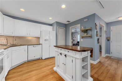 Bright & airy Kitchen OPENS to Dining & Family Rooms!