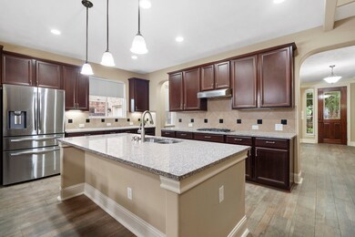 The kitchen blends elegance and functionality with