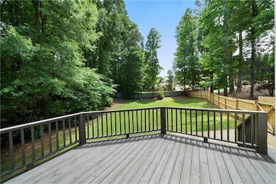 Wooden terrace featuring a fenced backyard