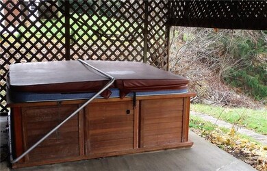 Hot Tub on lower level patio conveys with property