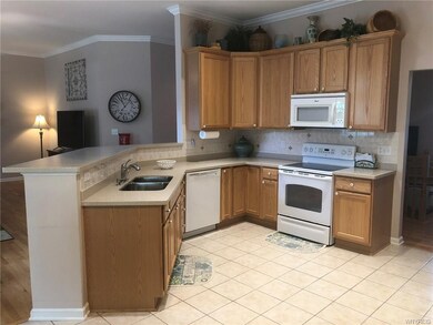 Breakfast bar and spacious kitchen overlooking gre