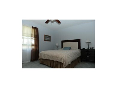 Master bedroom with ceiling fan.