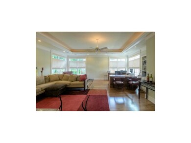 Large and lovely 23 x 23 great room has a soaring 
