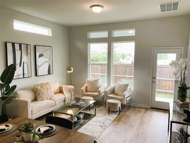 Living room featuring light wood-style flooring a