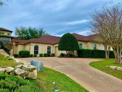View of front of home with stone siding, concrete