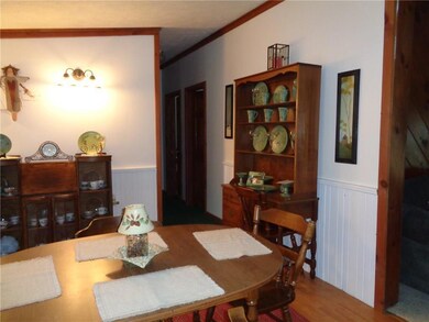 Formal dining room with laminate floor.