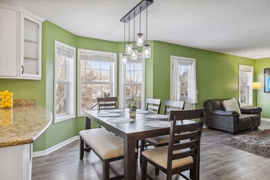 Informal bright dining room with walk out to the deck.