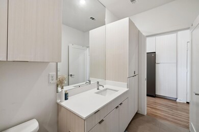 Bathroom featuring vanity and tile patterned floo