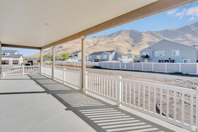 Fenced backyard with a patio, a mountain view, and a residential view